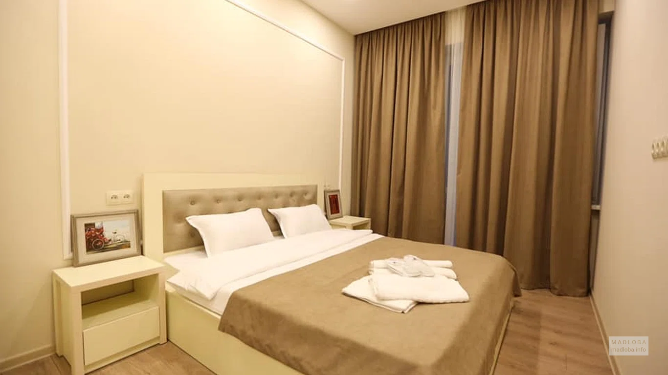 Кровать в номере Cozy Apartment
