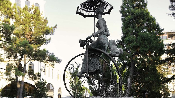 Fountain "Lady with a dog on a bicycle"