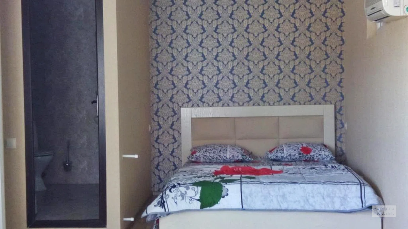 Кровать в номере GTNL Apart Hotel