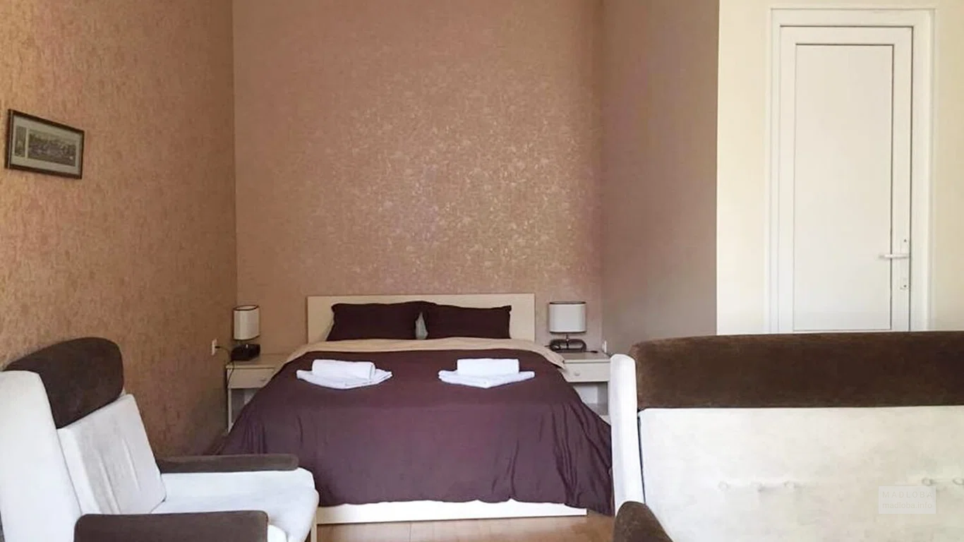 Кровать в номере Guest House Rampa