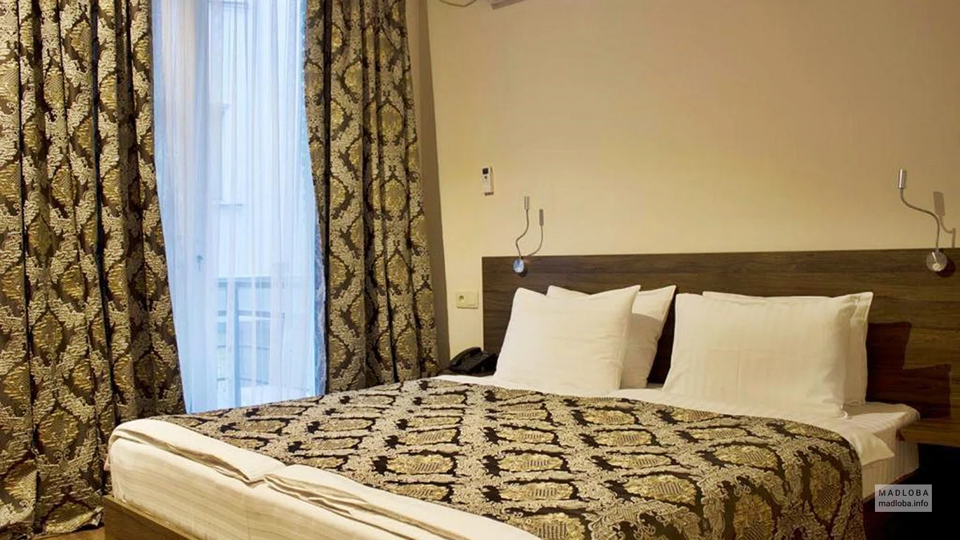 Кровать в Hotel 4U