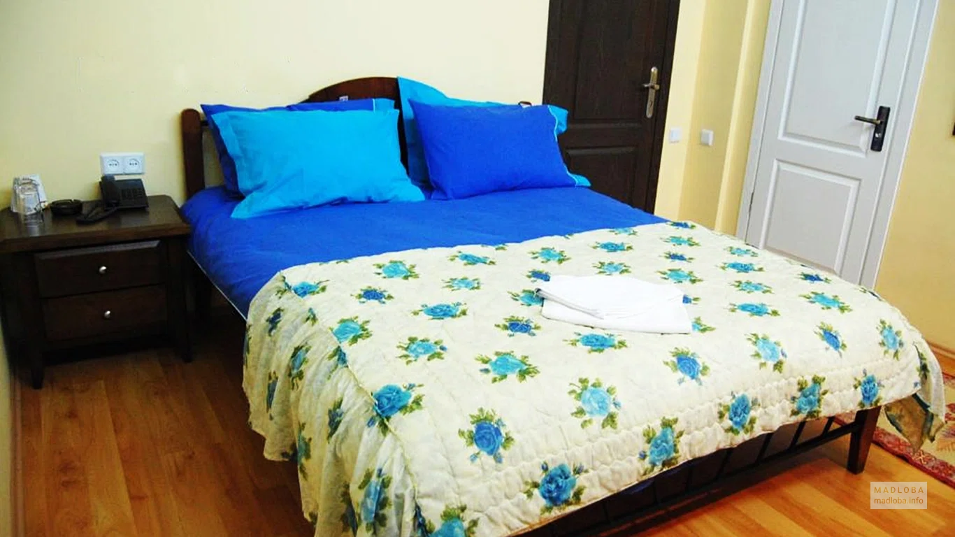 Bedroom in the Elegant Garden Hotel room