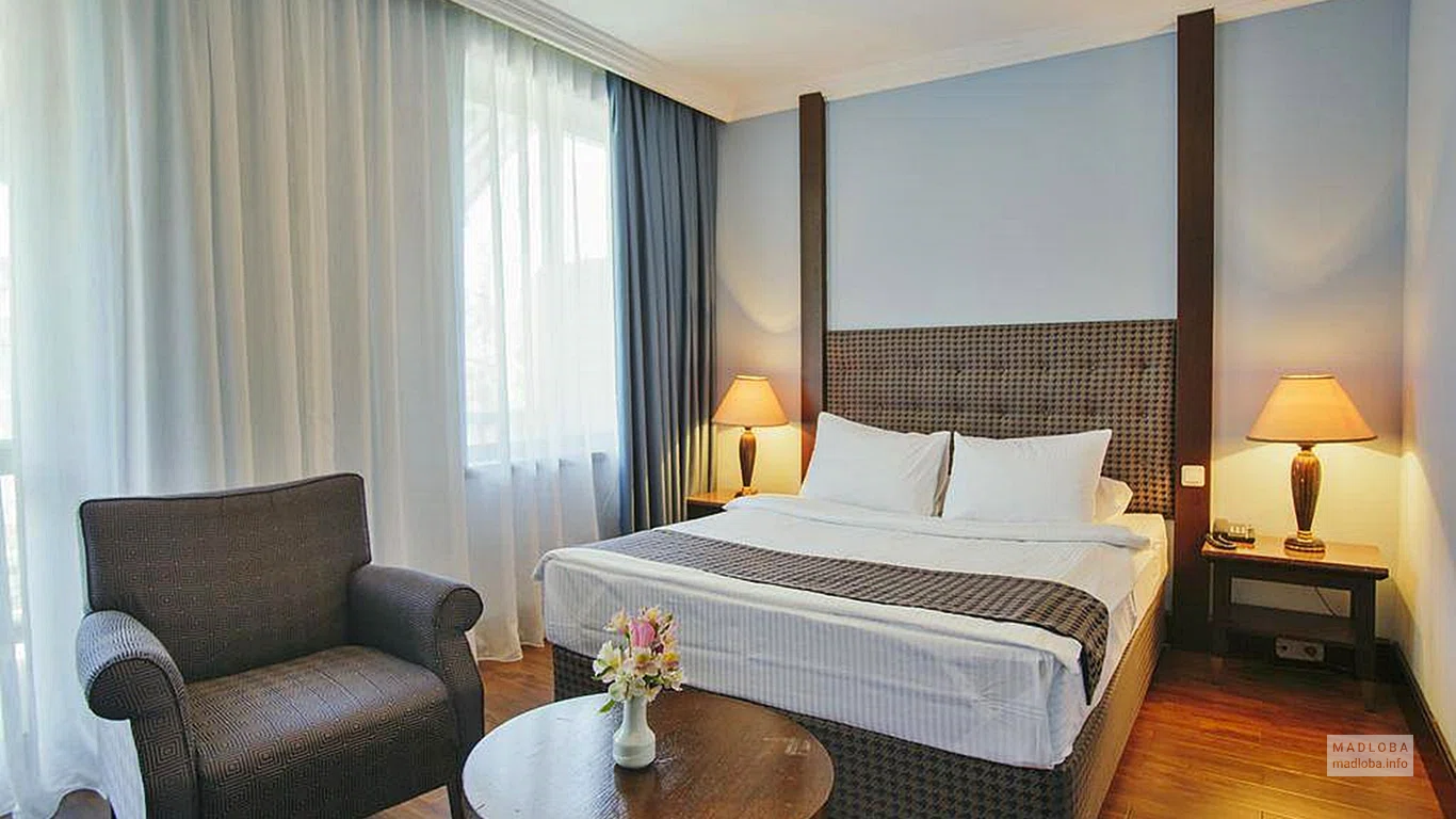 Bedroom in the room of Intourist Palace Hotel & SPA