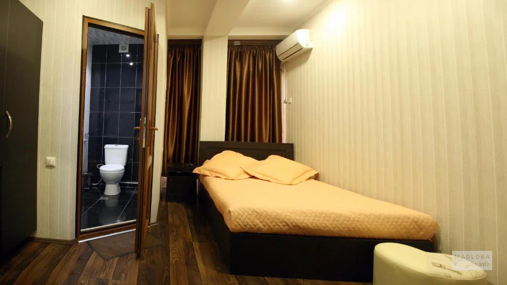 Кровать в номере Hotel Pyramida Грузия