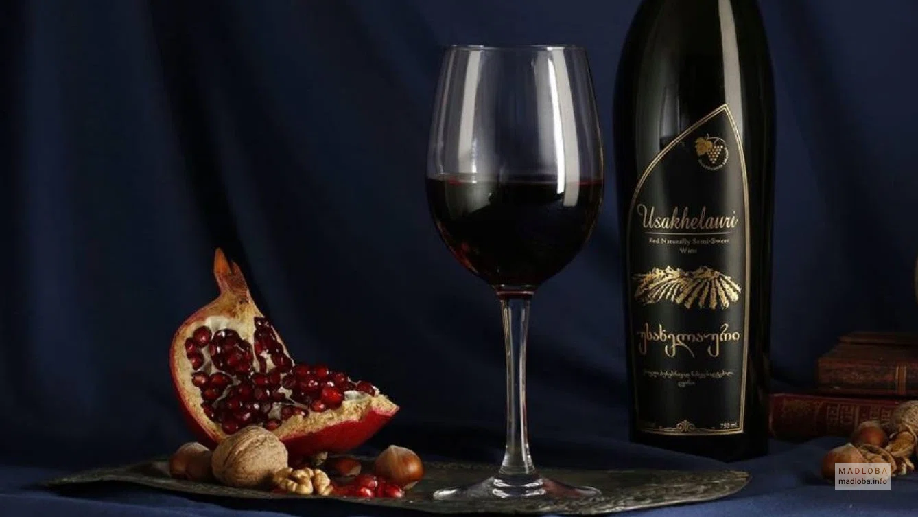 Вино и ломтик граната Mitra wine cellar