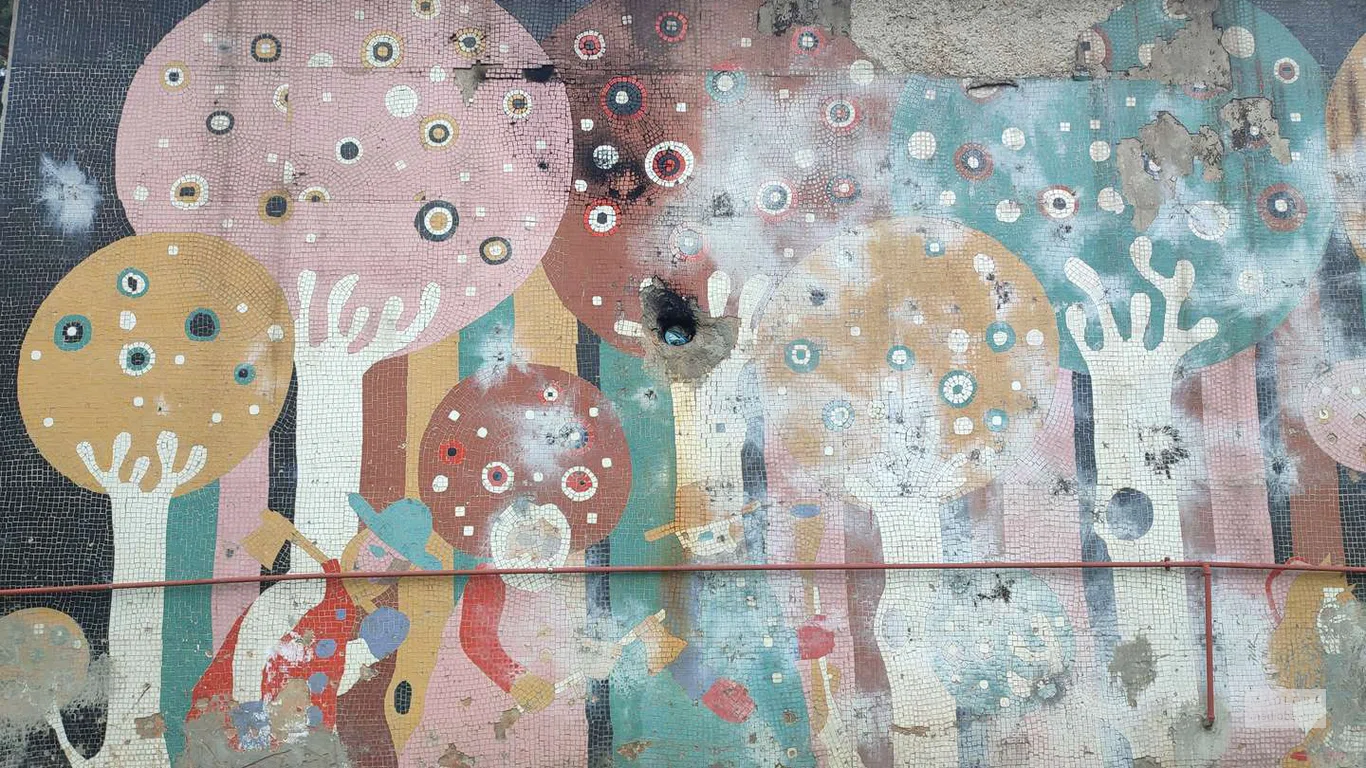 Soviet mosaic fence and facade decoration