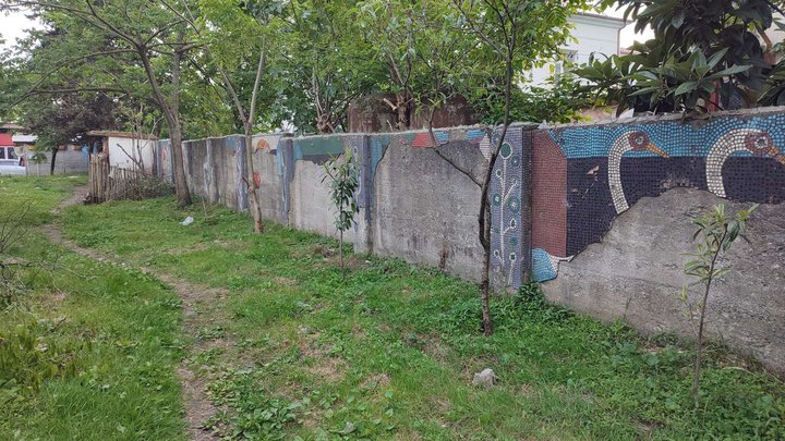 Soviet mosaic fence and facade decoration