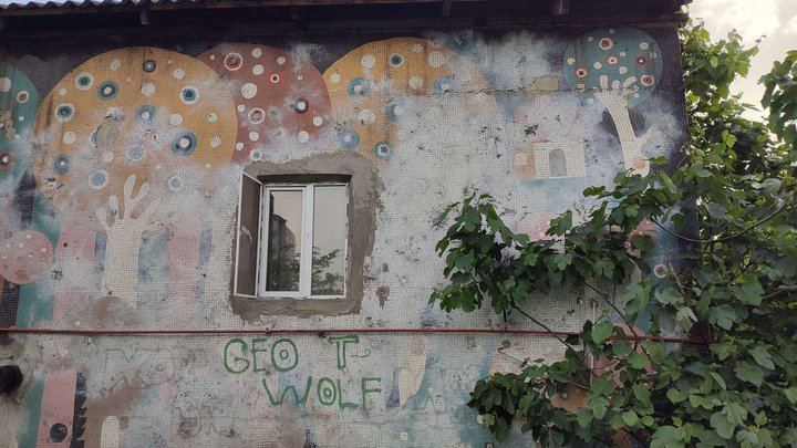 Soviet mosaic fence and facade decoration