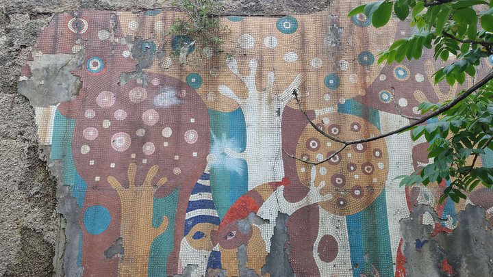Soviet mosaic fence and facade decoration