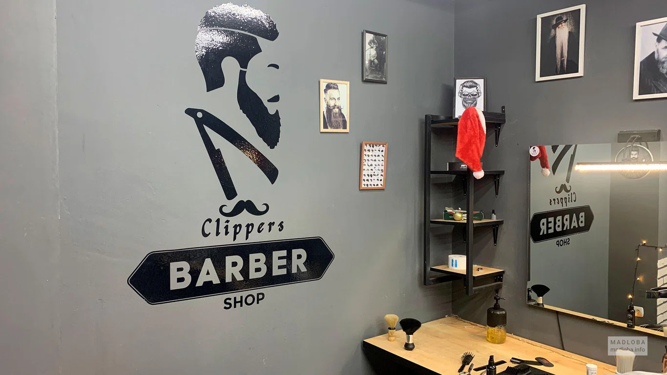 Логотип в Clippers Barbershop