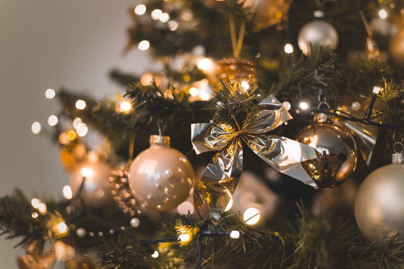 beautiful-baubles-and-string-lights-hanging-on-a-christmas-tree.jpg