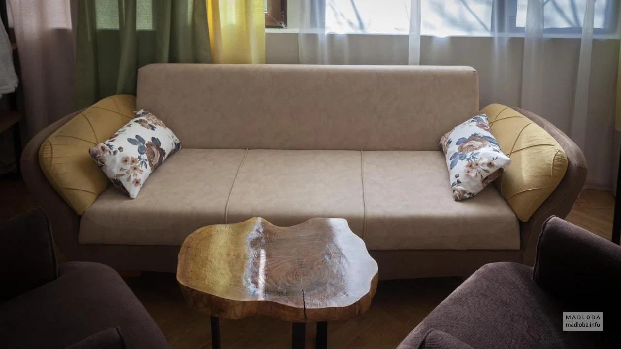 Диван в номере Bricks Room Hotel
