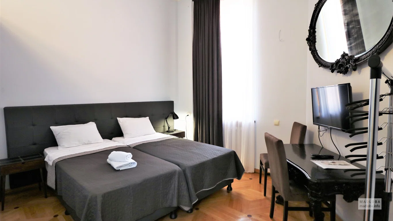 Кровать в номере Cabinet Boutique-Hotel