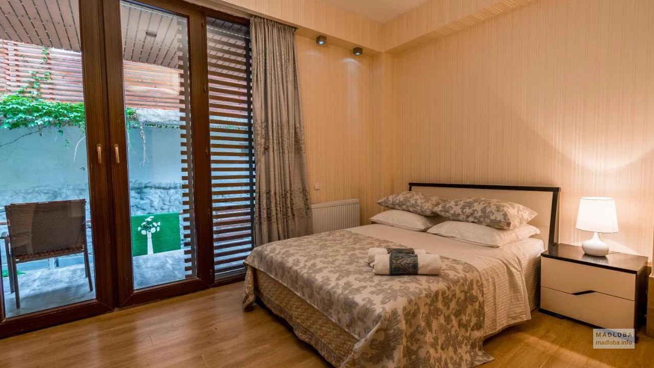 Кровать в номере City Core Apartments