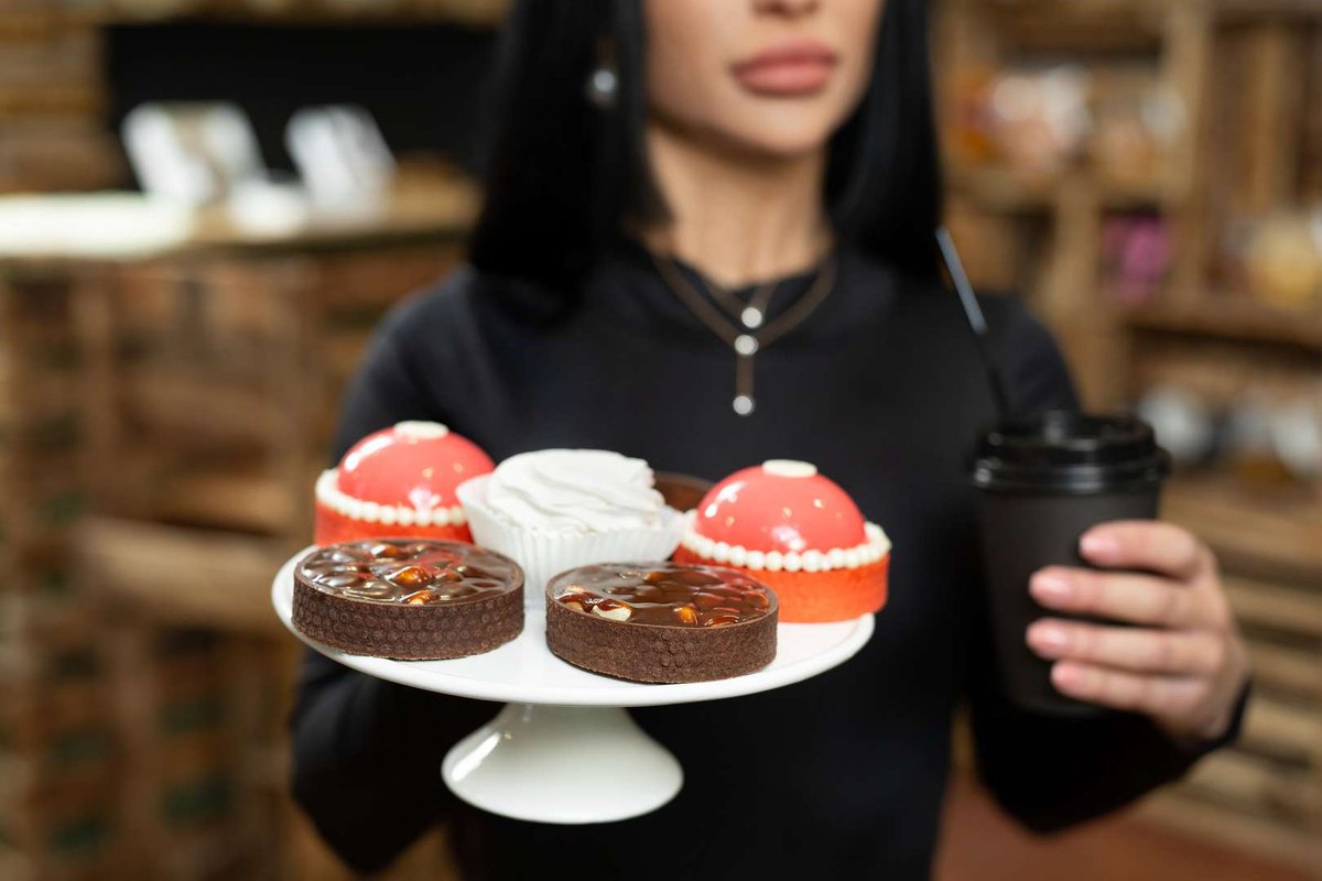 A girl with a dessert dish and coffee
