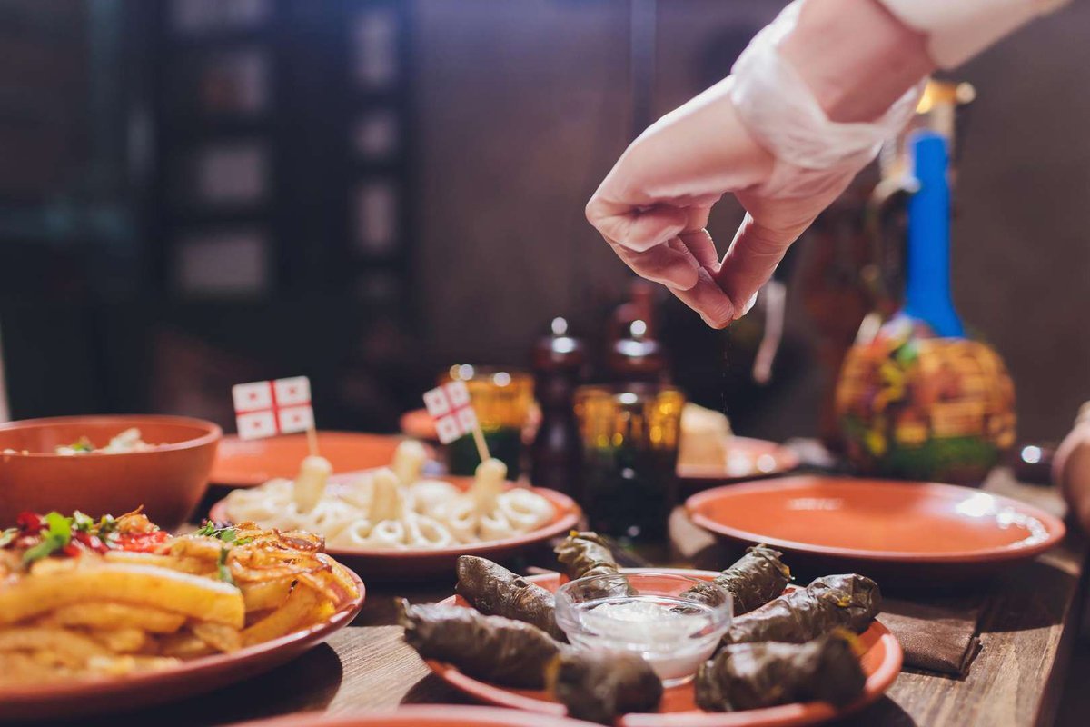 The chef adds the finishing touches to a traditional Georgian dish