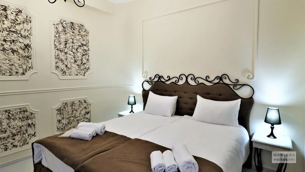 Кровать в номере The One Terrace Hotel Tbilisi