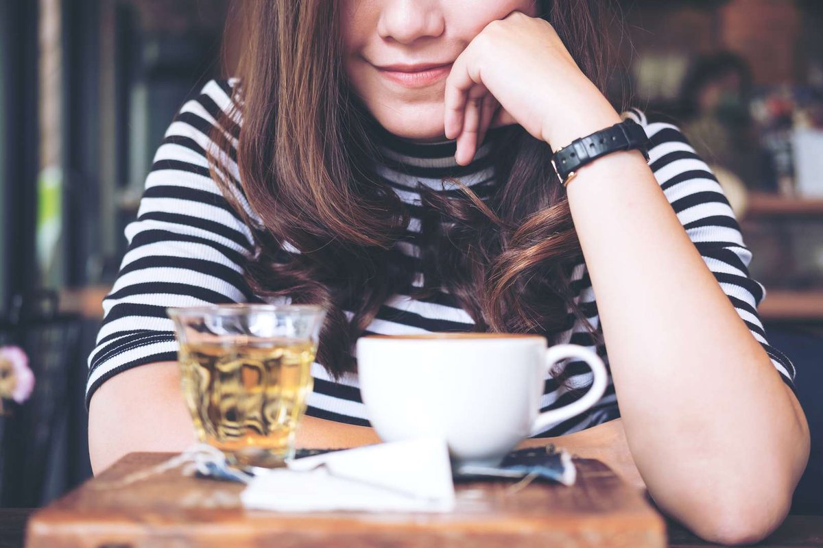 A girl with a brewed cup of tea