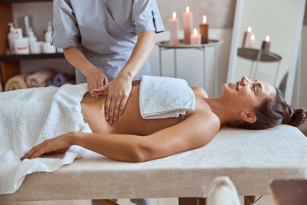 The girl gets a belly massage